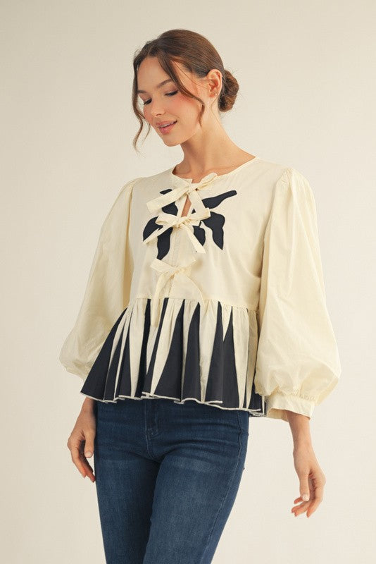 Midnight Bow Peplum Top