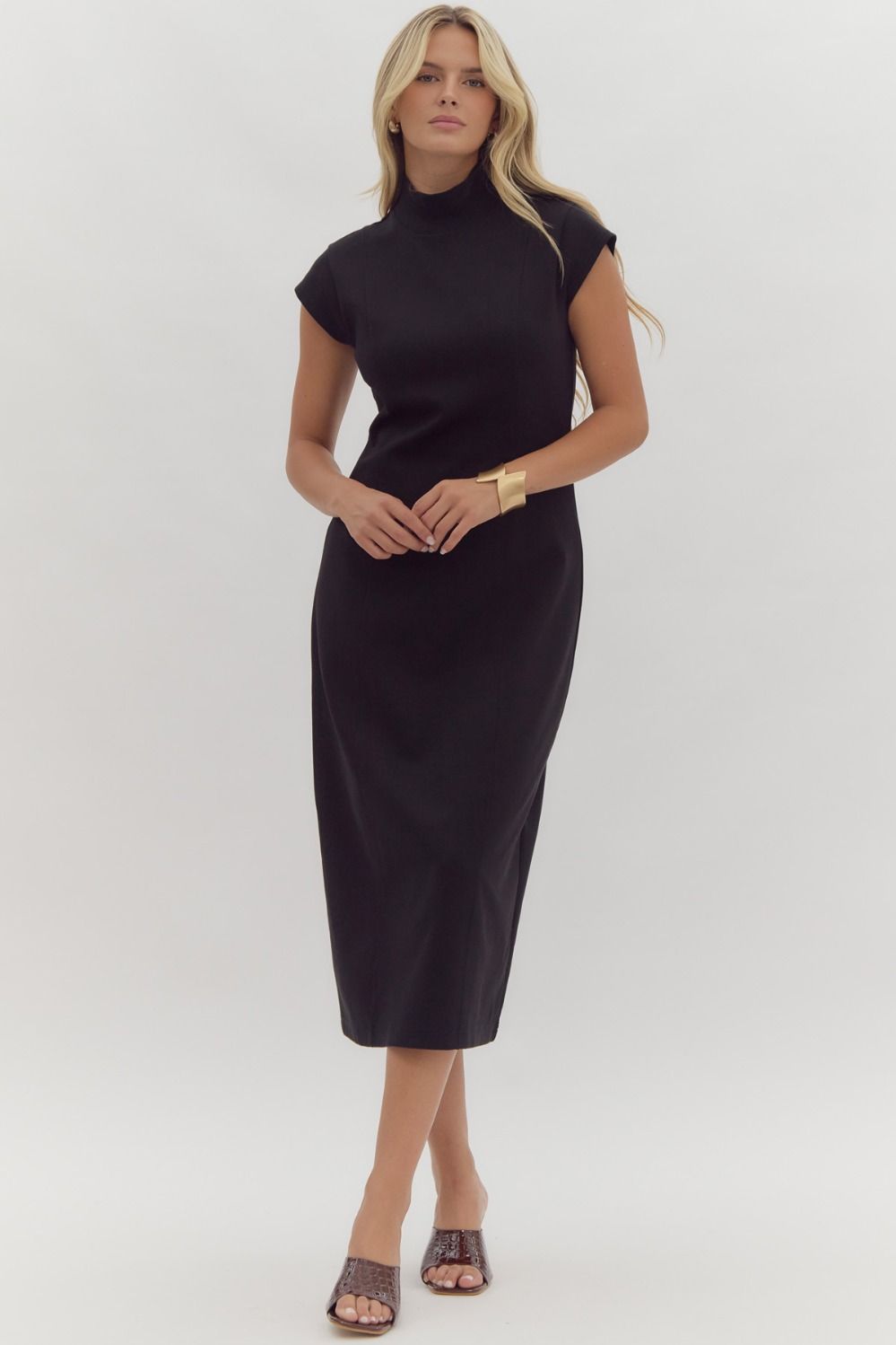 Black midi dress featuring ribbed mock neck